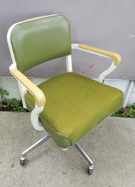 We love the mixture of materials in this vintage Steelcase office chair—especially the two-toned fabric seat with piping. Casters allow the chair to slide around with ease, and the white and yellow armrests make it both practical and comfortable.