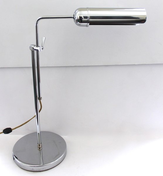 This lamp's slim profile and chrome finish vibe midcentury modern with with a contemporary edge. The vertical arm is adjustable, so you can raise or lower the lamp as required, and the tubular shade allows it to evenly light a wide surface area.
