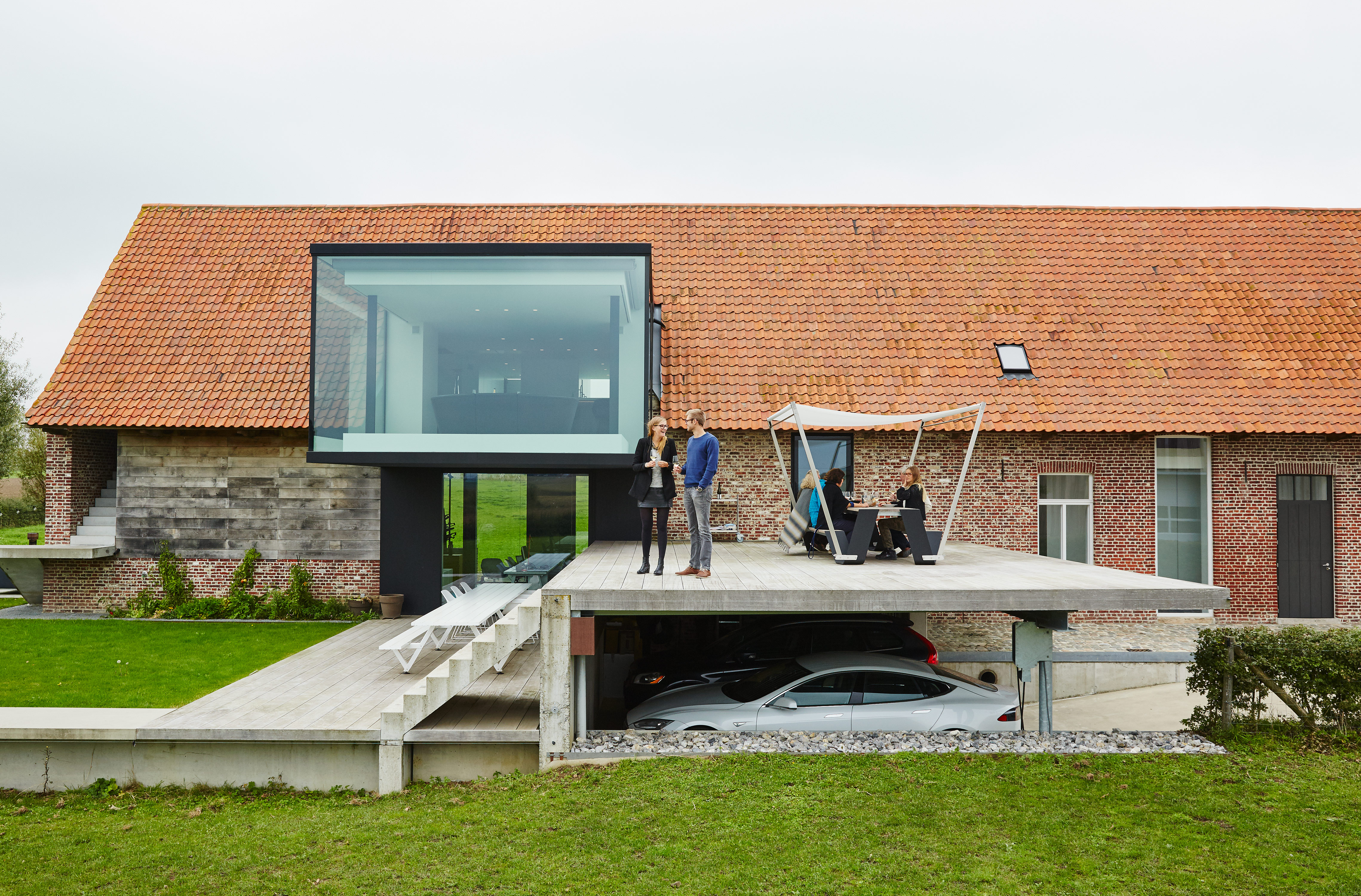 Atop the carport is a Hopper table and shade by Extremis